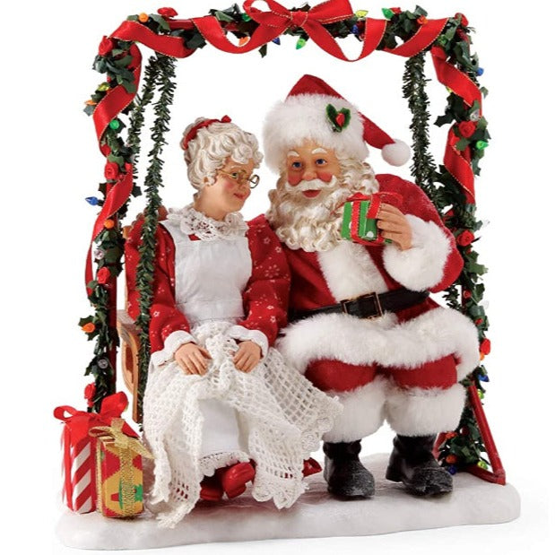 Santa & Mrs Claus on a swing