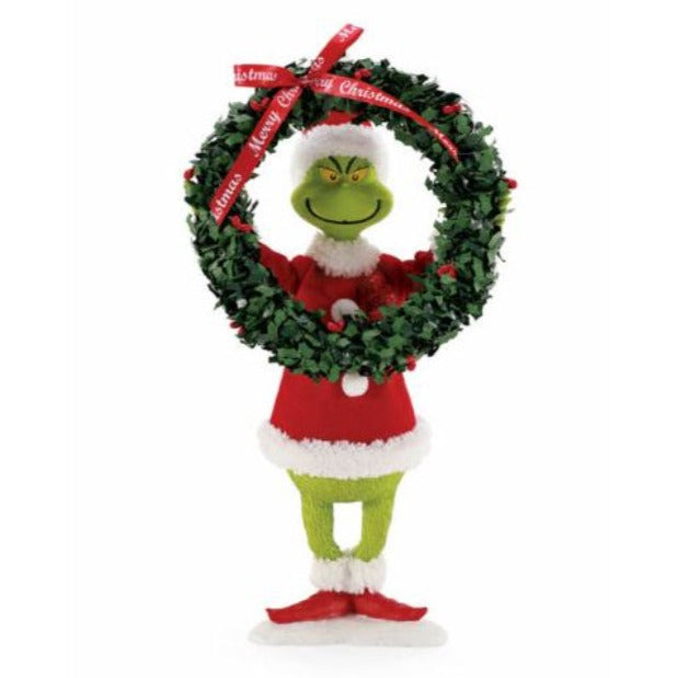 Standing grinch holding oversized wreath
